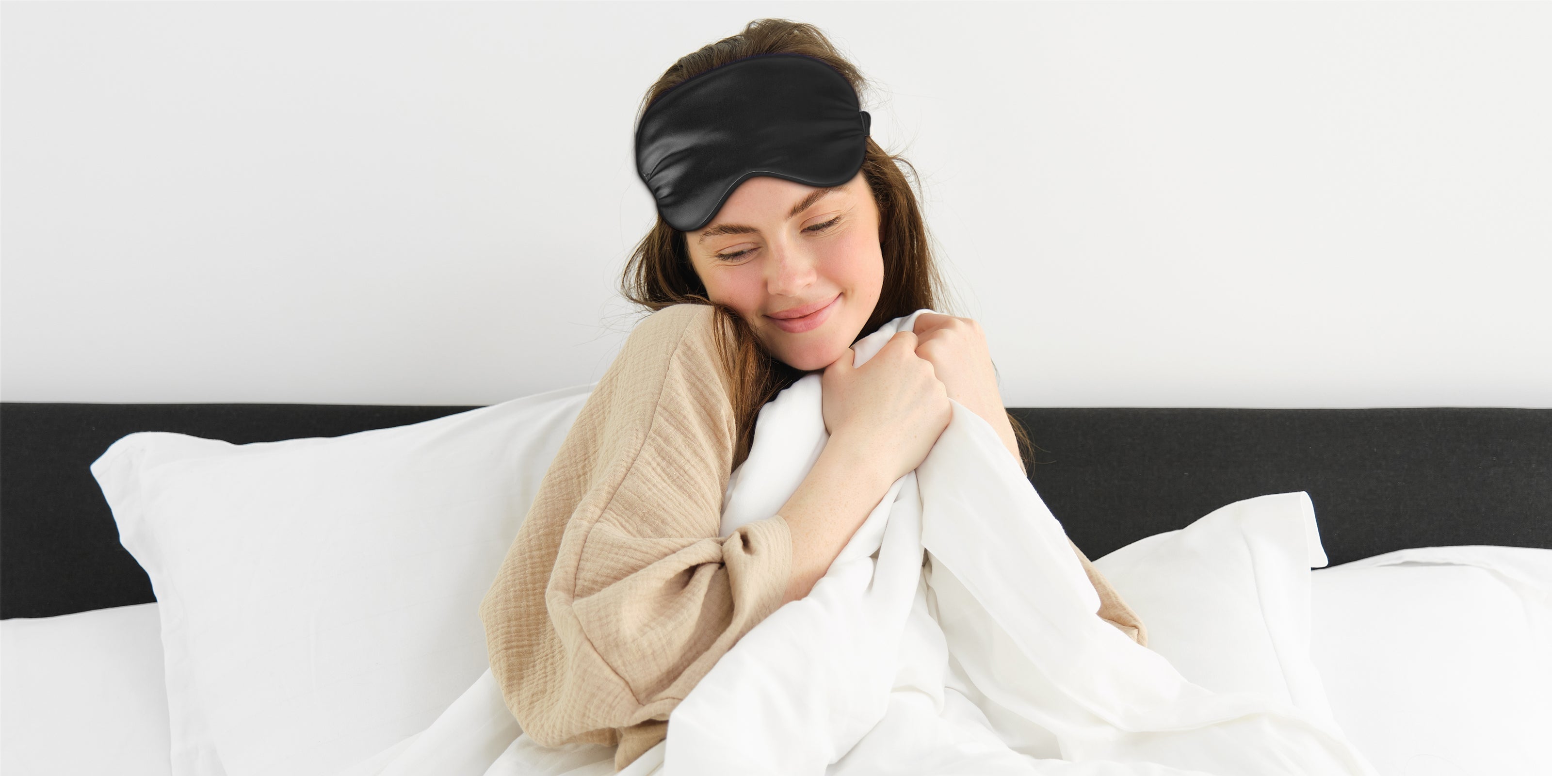 Gritin natural silk sleep mask resting on soft light-colored fabric