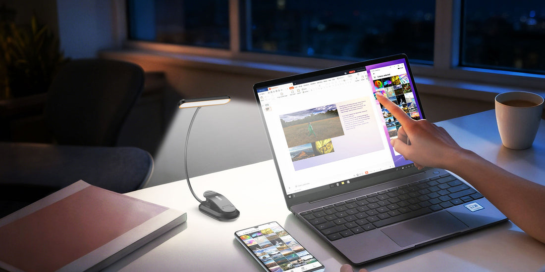 Rechargeable flexible LED gooseneck light clipped to a desk, illuminating a laptop keyboard for late-night work.